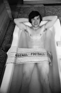 Arsenal footballer George Armstrong pictured in the bath at Highbury football ground