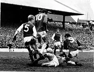with Arsenal goalkeeper on the ground where he injured his hand in a melee involving John