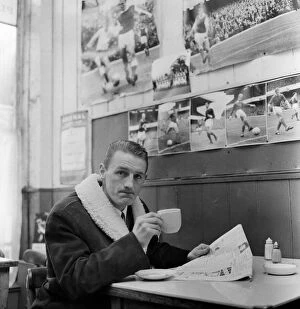 01232 Collection: Arsenal inside forward George Eastham sits with a cup of tea in a cafe near his club