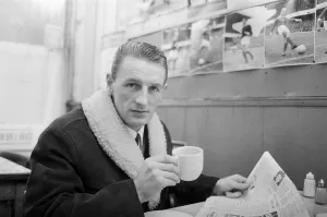 Arsenal inside forward George Eastham sits with a cup of tea in a cafe near his club