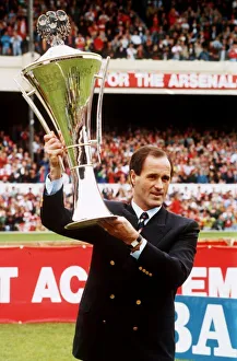 Arsenal manager George Graham holding lthew Manager of the Year Award aloft at Highbury
