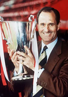 Core93 Prints: Arsenal manager George Graham holds the European cup winners cup trophy May 1994