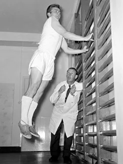 Arsenal physiotherapist Bertie Mee watches intently as Hendon outside right Terry Howard