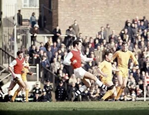 Wolverhampton Wanderers Collection: Arsenal v Wolves 1968 Mike Bailey of Wolves is brought down by George Graham of Arsenal. March 1968