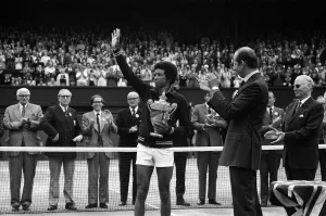 Sports Venue Prints: Arthur Ashe receives the trophy from the Duke of Kent after he defeated the defending