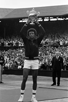 Arthur Ashe with the Wimbledon trophy after he beat the defending champion Jimmy Connors