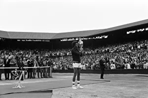 01267 Prints: Arthur Ashe with the Wimbledon trophy after he beat the defending champion Jimmy Connors