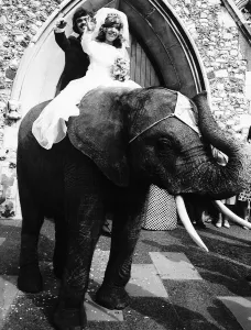 Arthur Dean and Penny Wheeler little people of the Circus Togni riding away from their