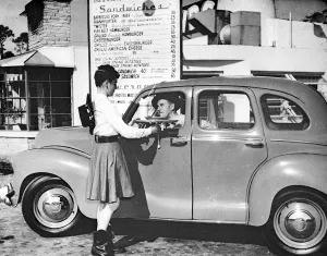 Serving Prints: Arthur Helliwell Sunday People correspondant seen here in a typical American drive thru