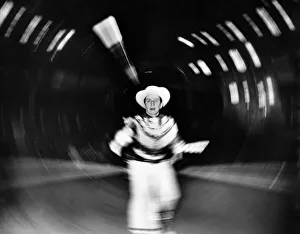 Danger Prints: Arthur Sidey Daily Mirror photographer takes his life in his hands as he spins around