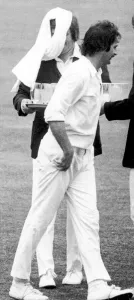 00279 Prints: The Ashes 1975. Australian fast bowler Dennis Lillee throws a towel over the head of