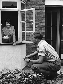 Aston Villa centre-forward Gerry Hitchens in the garden of his home