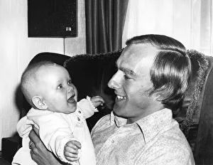 Man And Child Prints: Aston Villa football Ray Graydon with his five-month-old daughter