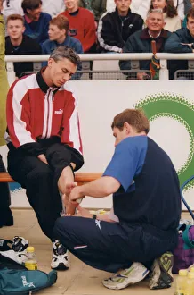 00403 Prints: Athlete Jonathan Edwards Jonathan Edwards has his ankle strapped by a doctor