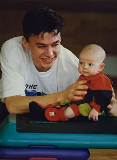 00403 Prints: Athlete Jonathan Edwards Jonathan Edwards with ten-week-old son, Sam
