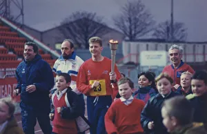 00399 Prints: Athlete Steve Cram Steve Cram carrying a torch for Children in Need