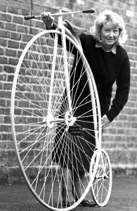 Core69 Prints: Auctioneer Barbara Turner with an old but in good condition penny farthing