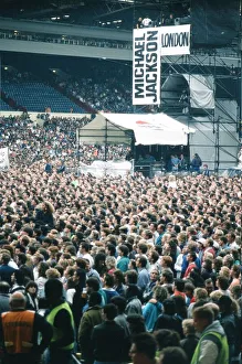 Audience gather outside the Wembley arena prior to the Michael Jackson concert