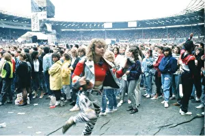 Audience gather outside the Wembley arena prior to the Michael Jackson concert