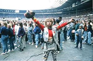 Audience gather outside the Wembley arena prior to the Michael Jackson concert