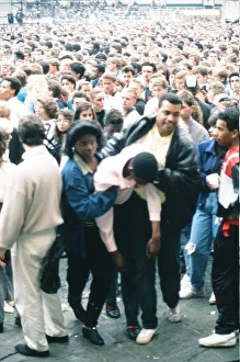 Audience gather outside the Wembley arena prior to the Michael Jackson concert