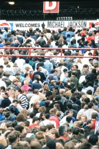 Audience gather outside the Wembley arena prior to the Michael Jackson concert