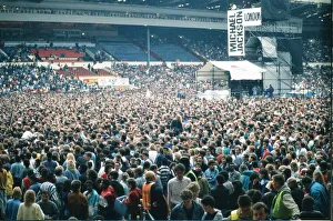 Audience gather outside the Wembley arena prior to the Michael Jackson concert