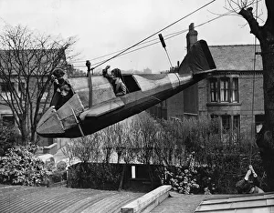 00203 Prints: Audrey Alma and Billie Disberry playing in a 14ft model bomber in their back garden