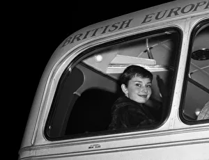 Audrey Hepburn pictured on a bus after arriving in London with her husband