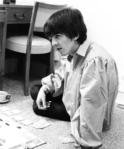 August 1964 George Harrison playing Monopoly at Bel Air home with Jackie De Shannon