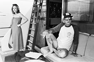 Boats Prints: Author Harold Robbins takes a day off from writing his new novel