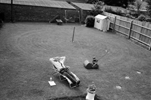 Chores Prints: Automatic grass cutting. BOAC pilot Pat Alley demonstrating his mowing method in his