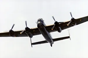 Avro Prints: An Avro Lancaster bomber in flight over Littleton Road playing fields, Manchester