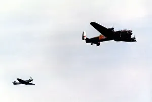 Air Display Prints: An Avro Lancaster bomber and Supermarine Spitfire fighter aircraft of the Battle of