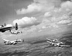 Avro Lancasters bomber from 35 Squadron in flight over the English countryside