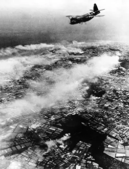 00154 Prints: A B25 Marauder bomber of the USaF dive bombs Cherbourg Peninsula during WW2 air raid