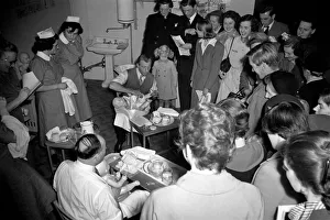 Doll Prints: Baby-craft competition. Ian Stewart demonstrating how to bath a baby