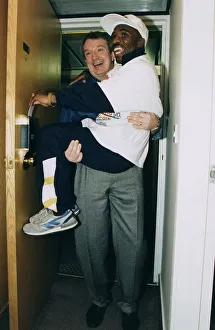00003 Prints: Baby Jake Matlala boxer being carried througth door by fight promoter Tommy Gilmour