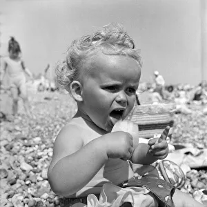 Baby and Lolly. Derorah Ann Clowes 13 months from Stoke on treat enjoys herself in