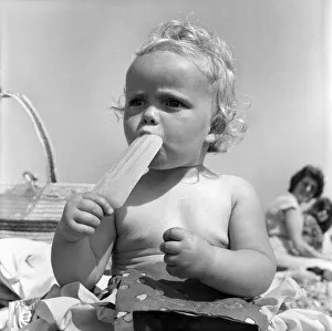 Baby and Lolly. Derorah Ann Clowes 13 months from Stoke on treat enjoys herself in