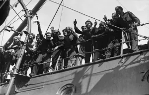 Firemen Prints: The baby of a Royal Navy officer is christened on a submarine during the Second world War