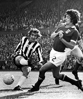 1974 Prints: A bad one for Newcastles Micky Burns as his shot cannons off Geroge Burley