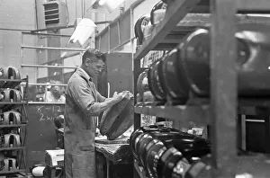 Badges and decals being applied to the saddle tanks of the BSA motorcycles at the BSA