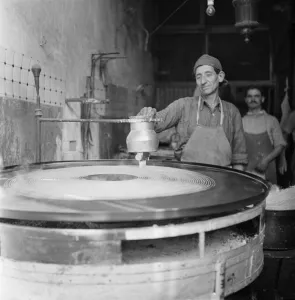 00014 Prints: A baker making bread in a town in Cyprus. March 1952 C1297-006