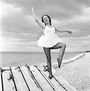 Ballerina Anne Youngmen seen here in a tutu practising her dance moves beside the sea