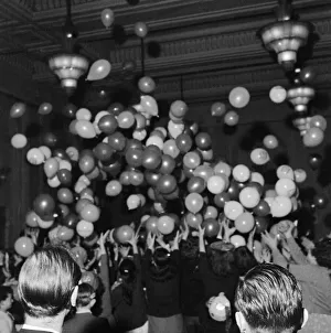 Parties Prints: Balloons being released at a childrens party in Soho, London. December 1956