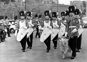 The band and drums of the Royal Welsh Fusiliers march past the Lord Mayor of Cardiff Ald