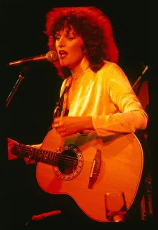 Barbara Dickson singer actress December 1978 on stage singing playing guitar