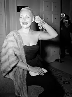 Barbara Payton American Film Actress in London wearing fur stole. 24 July 1952