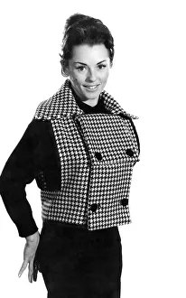 Barbara Pinney wearing a check sleeveless jacket December 1959 P006981